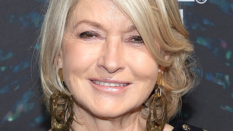 Martha Stewart with wide smile and dangling earrings
