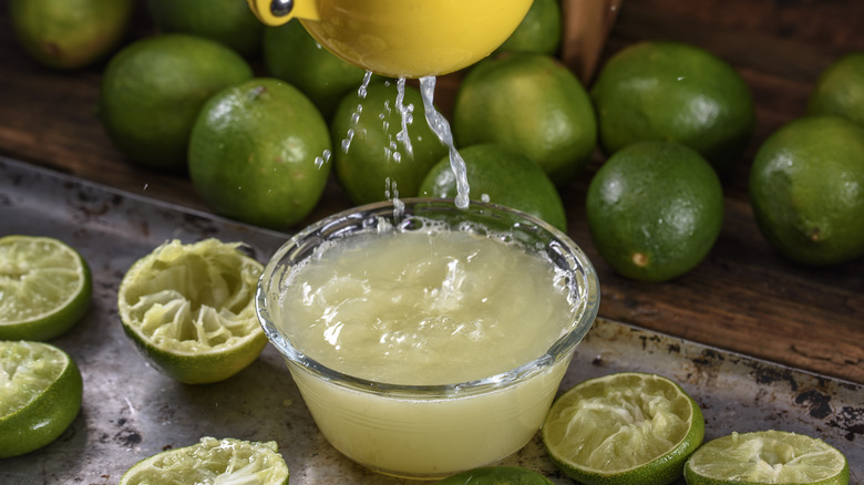 squeezing lime juice into bowl
