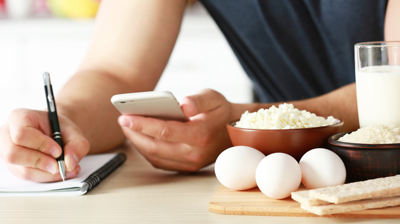 Person writing in notebook