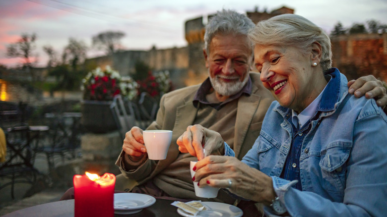 couple having coffee at sunset