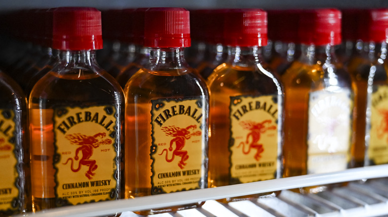 mini bottles of Fireball whisky on shelf