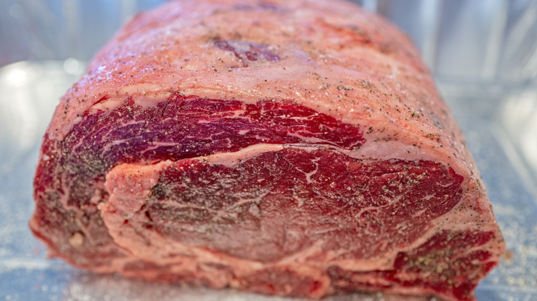 Prime rib with sides on plate