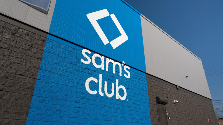 A modern Sam's Club logo outside a store, in lower case with a  logo above the text