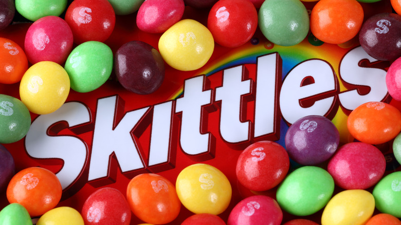 Skittles logo surrounded by skittles