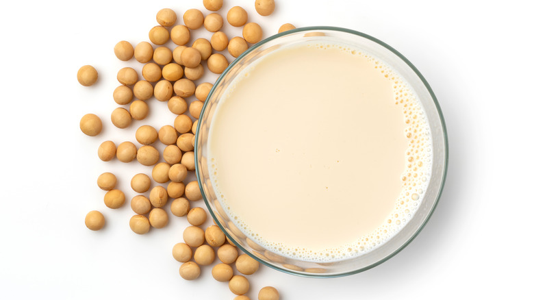 Glass of soymilk with soybeans