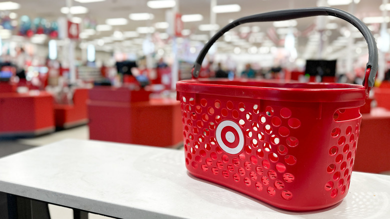 Close-up of a Target shopping basket with the registers blurred in the background