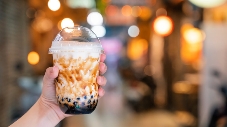 Hand holding tiger bubble tea