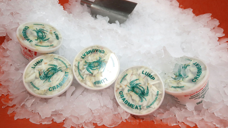 crab meat containers on ice