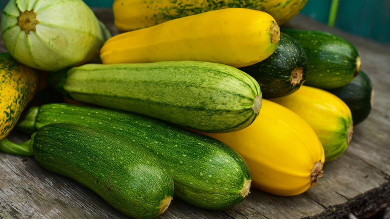 Green and yellow zucchini on a table