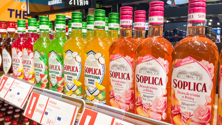 A selection of flavored Polish vodkas on display in a supermarket