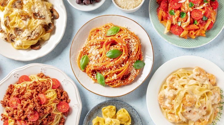 various pasta dishes on table