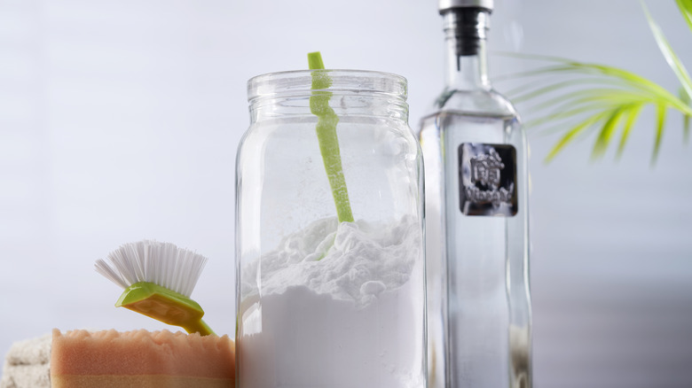 baking soda, vinegar, cleaning tools