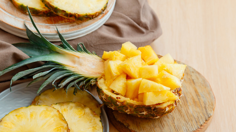 cut pineapple inside pineapple shell
