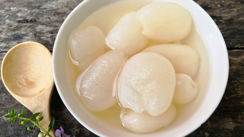 Peeled rambutans in bowl