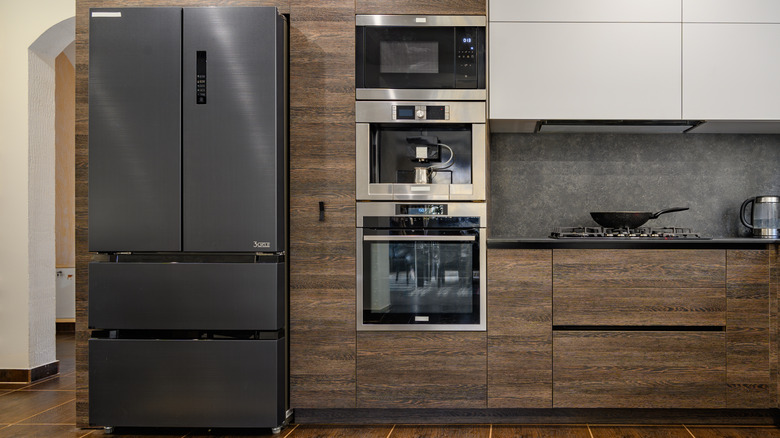 Kitchen with black stainless steel refrigerator