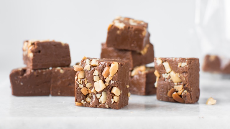 Chocolate fudge squares topped with nuts
