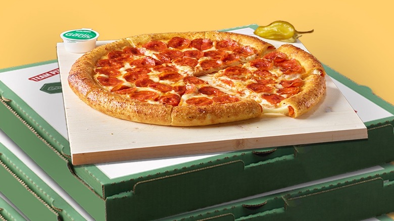 Papa John's pizza on top of pizza boxes