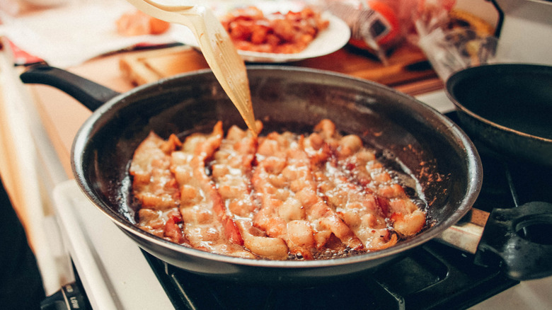 Bacon in a frying pan.