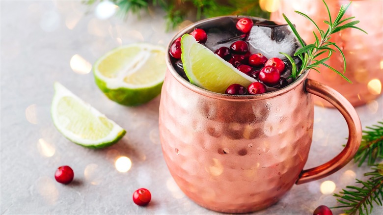 Cocktail in mug with cranberries 