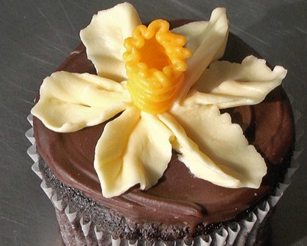 Daffodil icing flower on a cupcake
