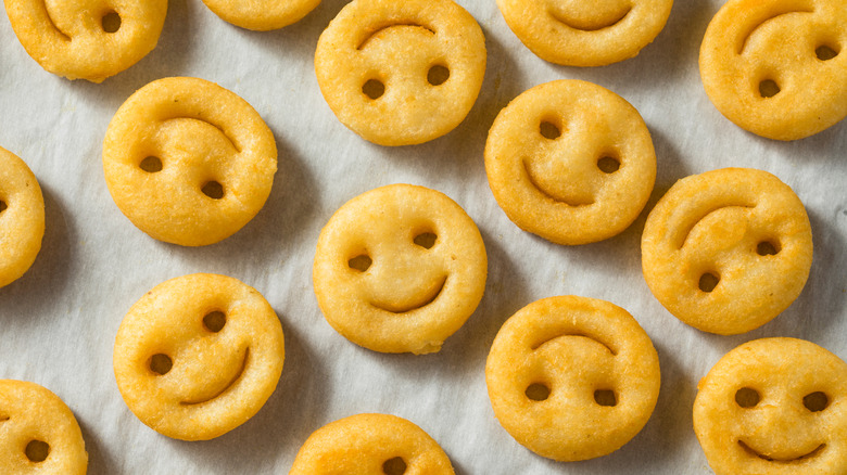 cooked smiley fries on paper