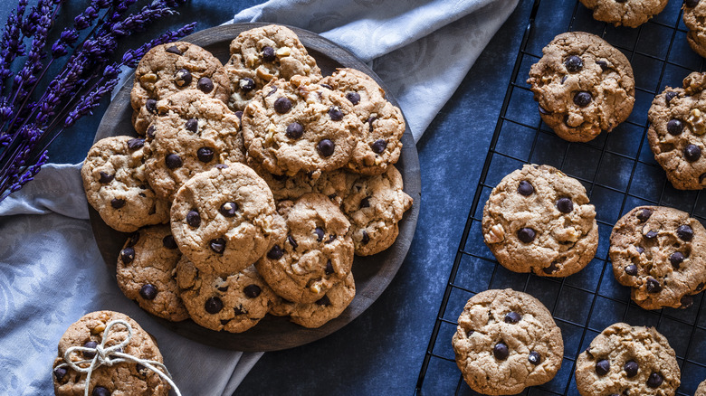 Brown butter chocolate chip cookies on a plate and blue tablecloth