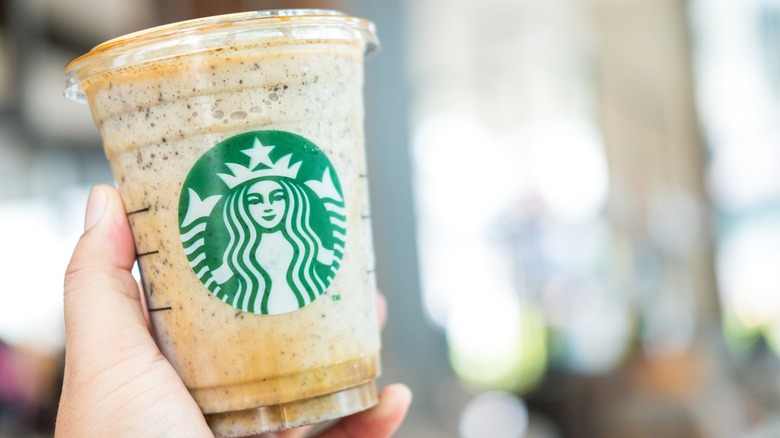Iced Starbucks drink in hand