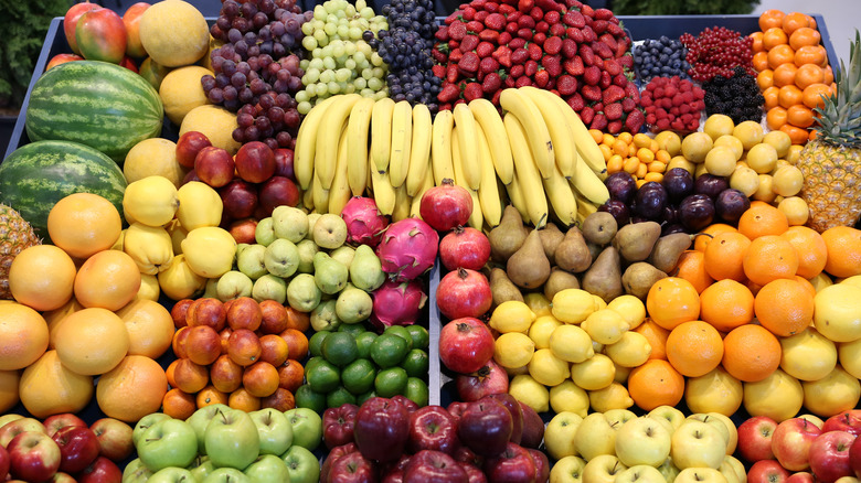 various fruits in rows of bins