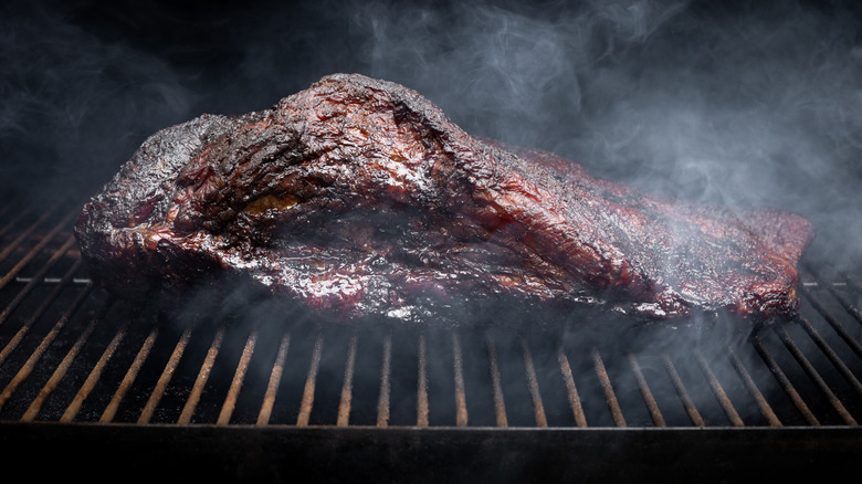 A piece of meat being smoked