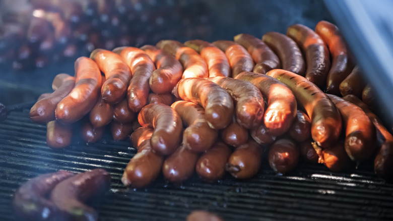 Stack of hot dogs on grill