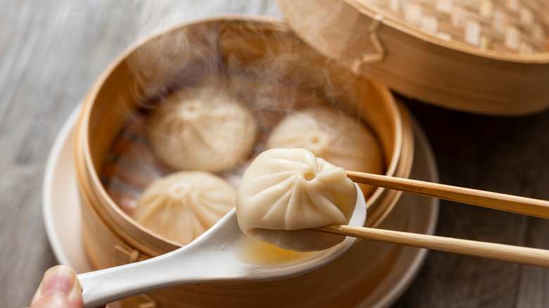 steamed dumplings inside bamboo basket