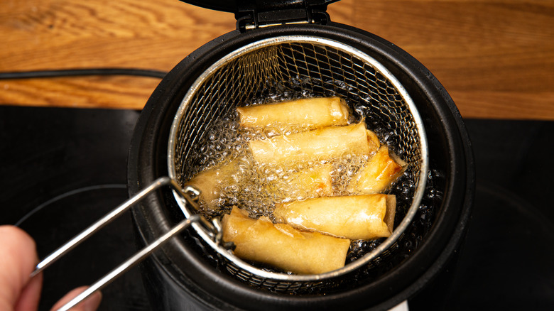 https://www.thedailymeal.com/img/gallery/how-to-properly-clean-and-maintain-a-deep-fryer/intro-1693313607.jpg