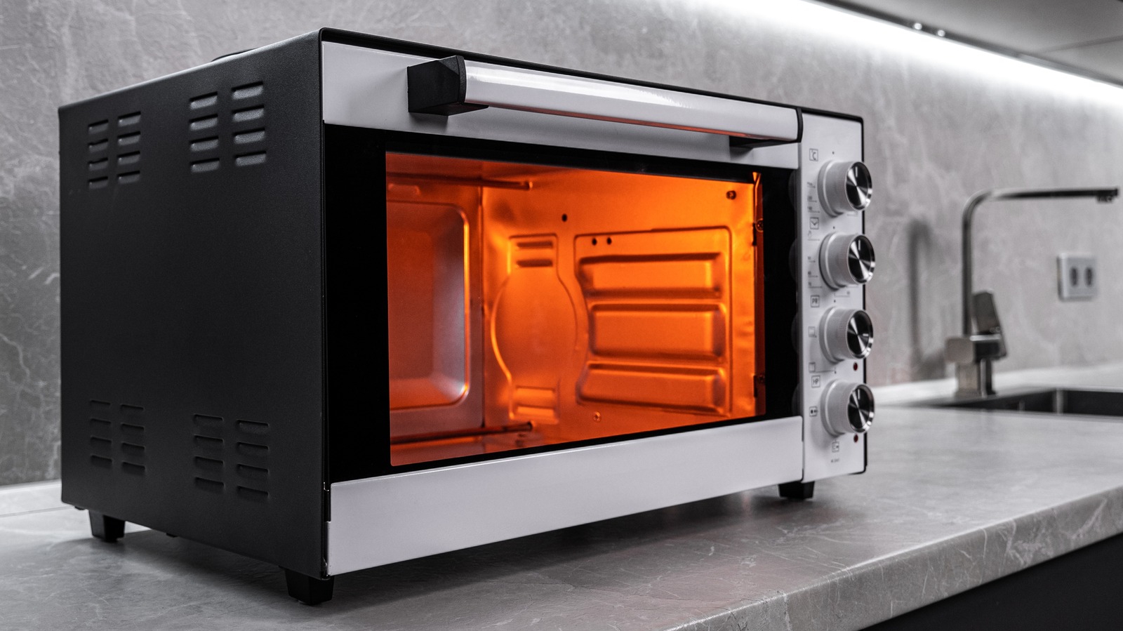 https://www.thedailymeal.com/img/gallery/how-to-properly-clean-that-crumb-filled-toaster-oven/l-intro-1702636720.jpg