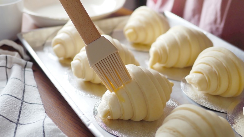 Silicone pastry brush on croissant