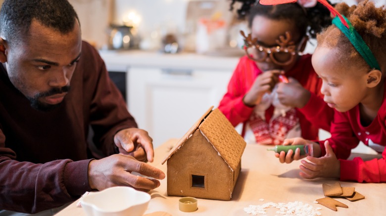 A family making a gingerbread house