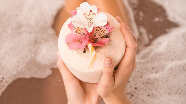 Relaxing in a tub with a drink