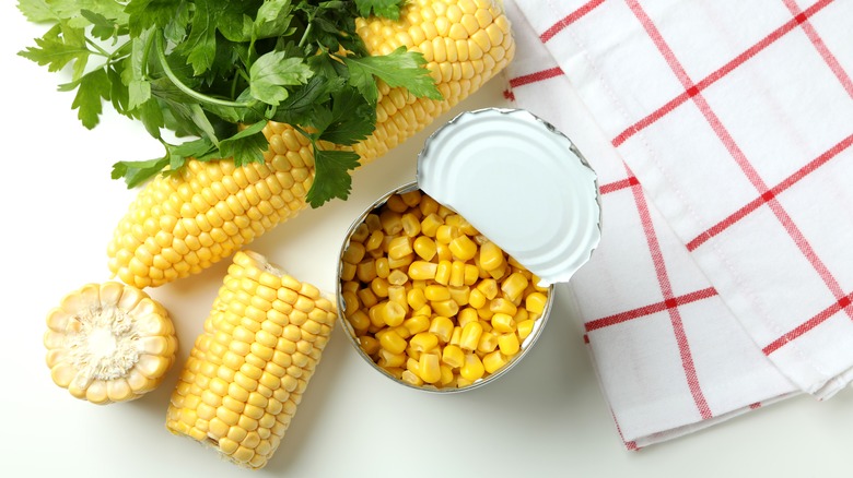 Open can of corn with cobs