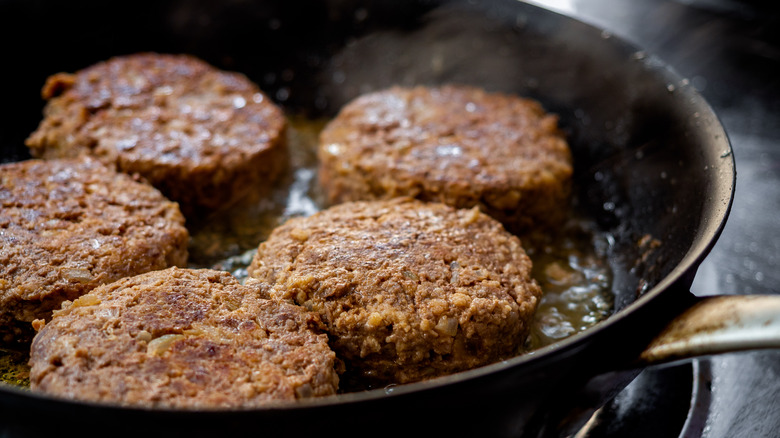Beef patty in skillet