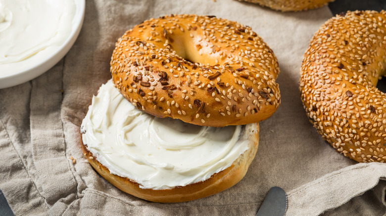 Open everything bagel with cream cheese
