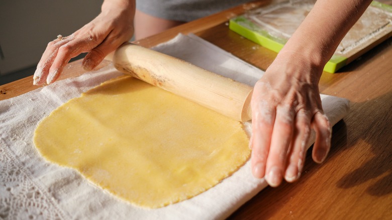 Person using rolling pin
