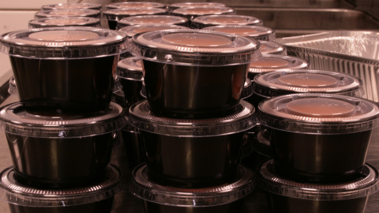 Sauces in takeaway containers.