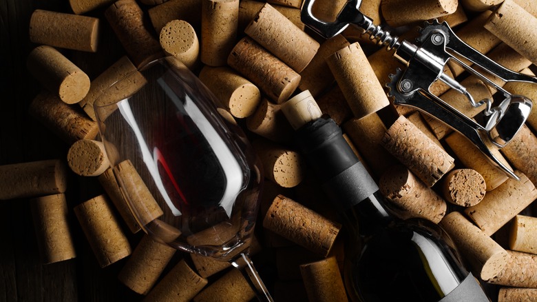 Wine bottle on corks with corkscrew