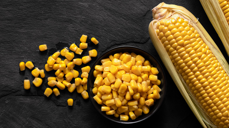 Corn kernels in bowl and in husk