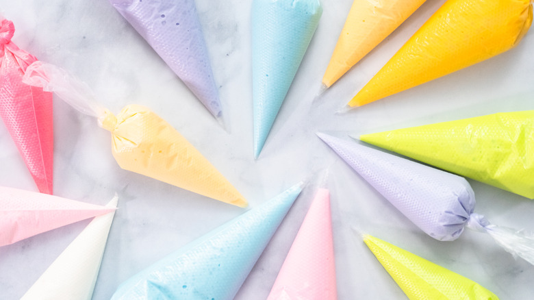 Multicolored bags of royal icing