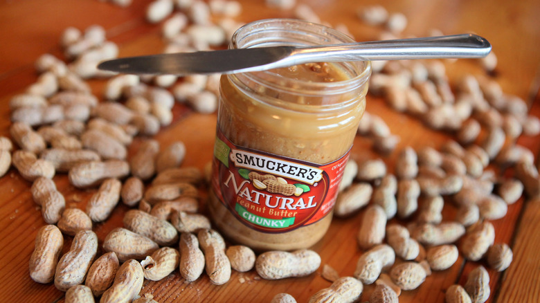 Jar of Smuckers natural peanut butter on a table