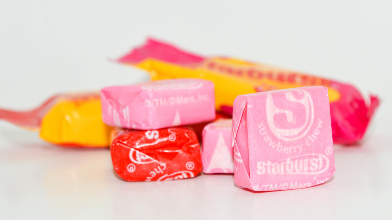 Pieces of Mars Starburst candy pink and red