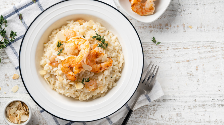 Bowl of risotto with shrimp and nuts