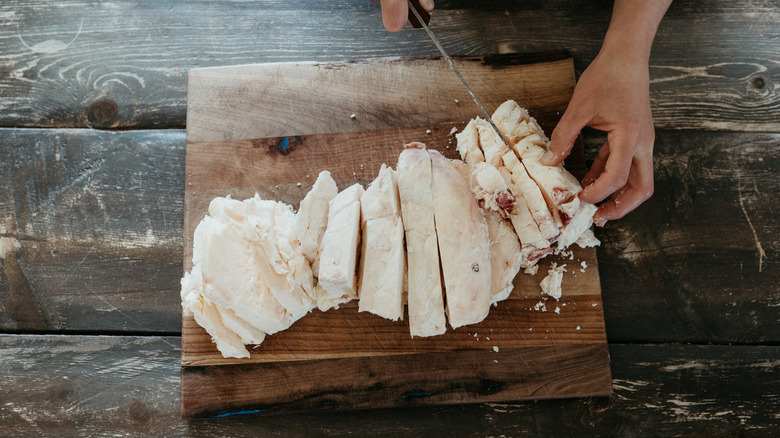 A person cooking with beef tallow in the kitchen.
