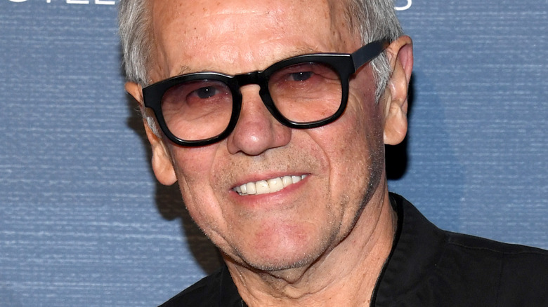 Wolfgang Puck smiling in glasses