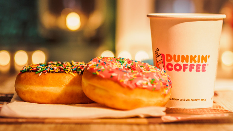 Two donuts and Dunkin cup